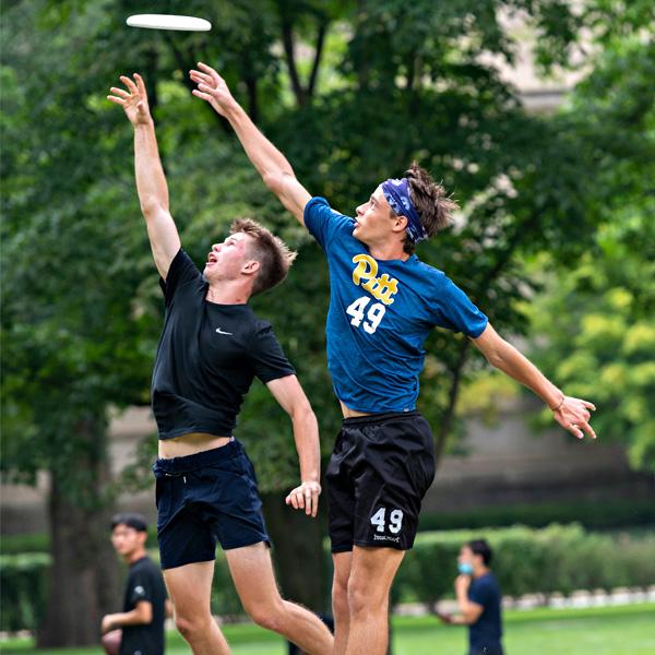 Students playing frisbee