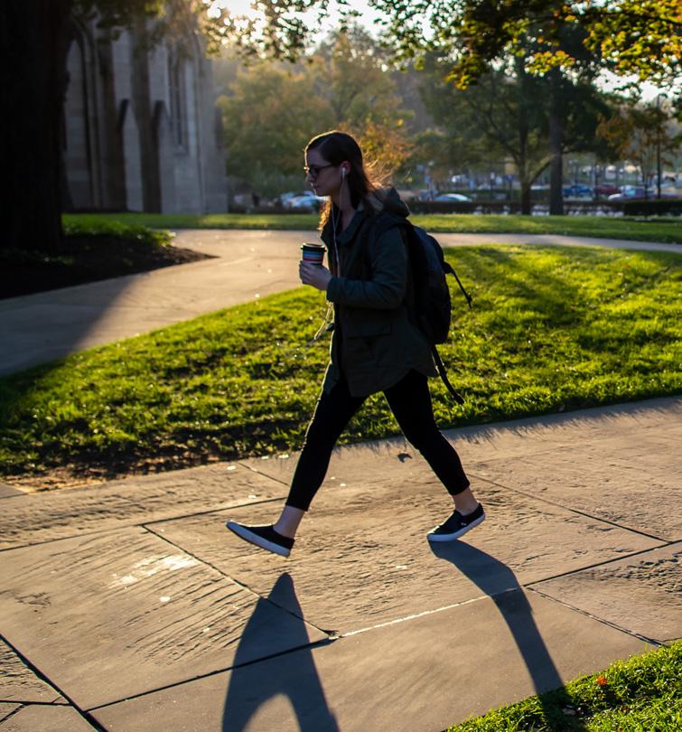 Student walking on campus.
