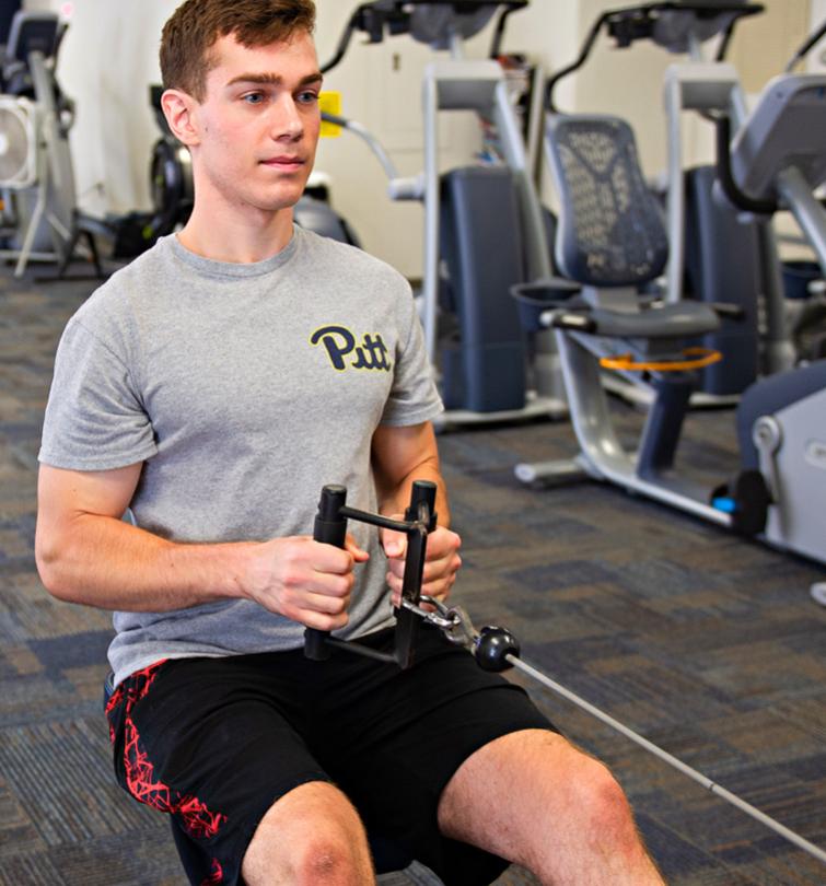 Student working out in campus rec facility