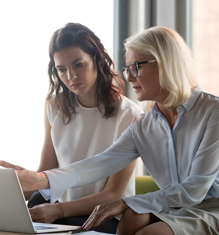 Student and teacher at computer