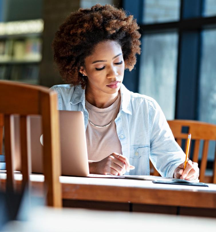 Woman writing in notebook