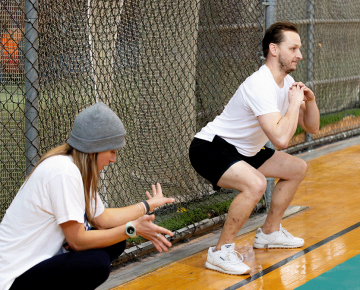 A male student being coached by a staff member.