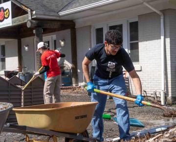 Two people digging with shovels