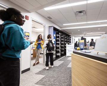 Students standing in Student Success Hub