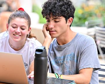 Students working at laptop