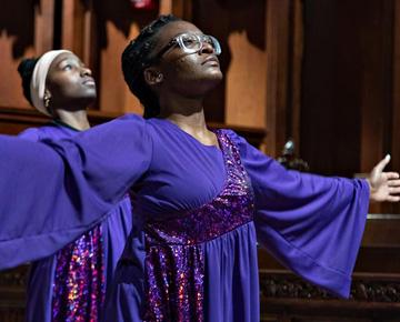 Woman wearing a majestic purple robe.