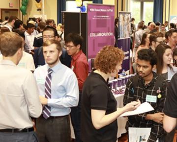 People crowded indoors at an event.