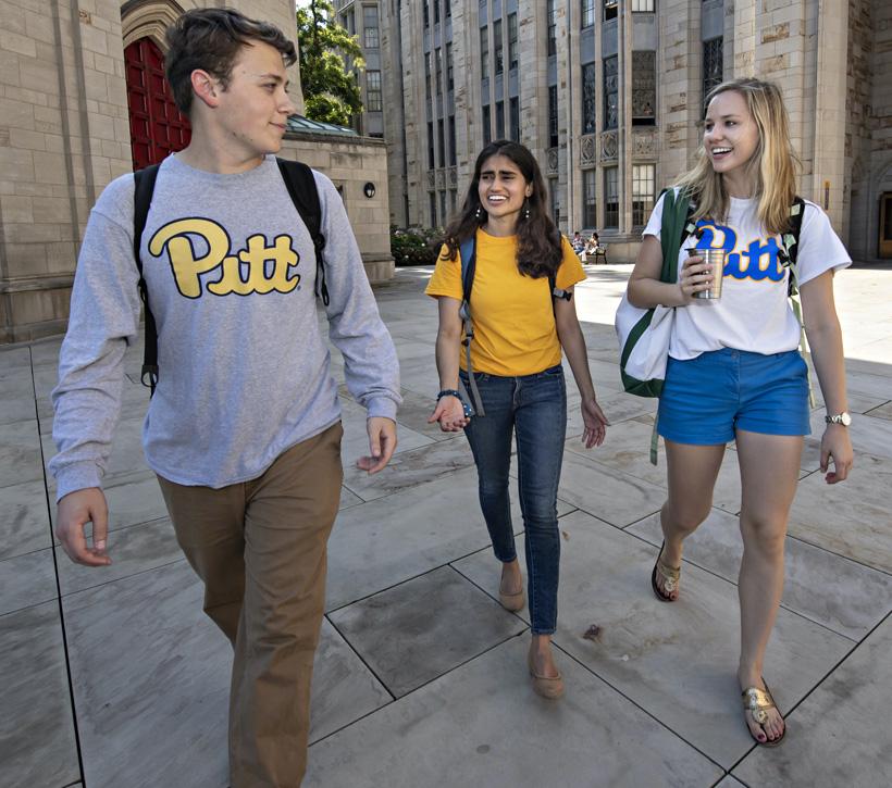 Three students walking 