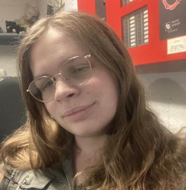 Girl in glasses smiling