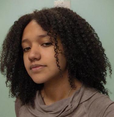 Young woman in brown shirt