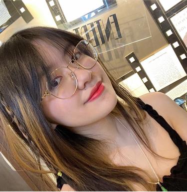 Woman with glasses smiling