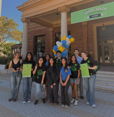 A group of ten students standing outside WPU.